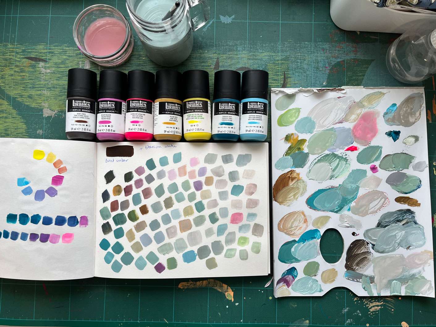 Mixing neutrals from bright colours using burnt umber and titanium white.